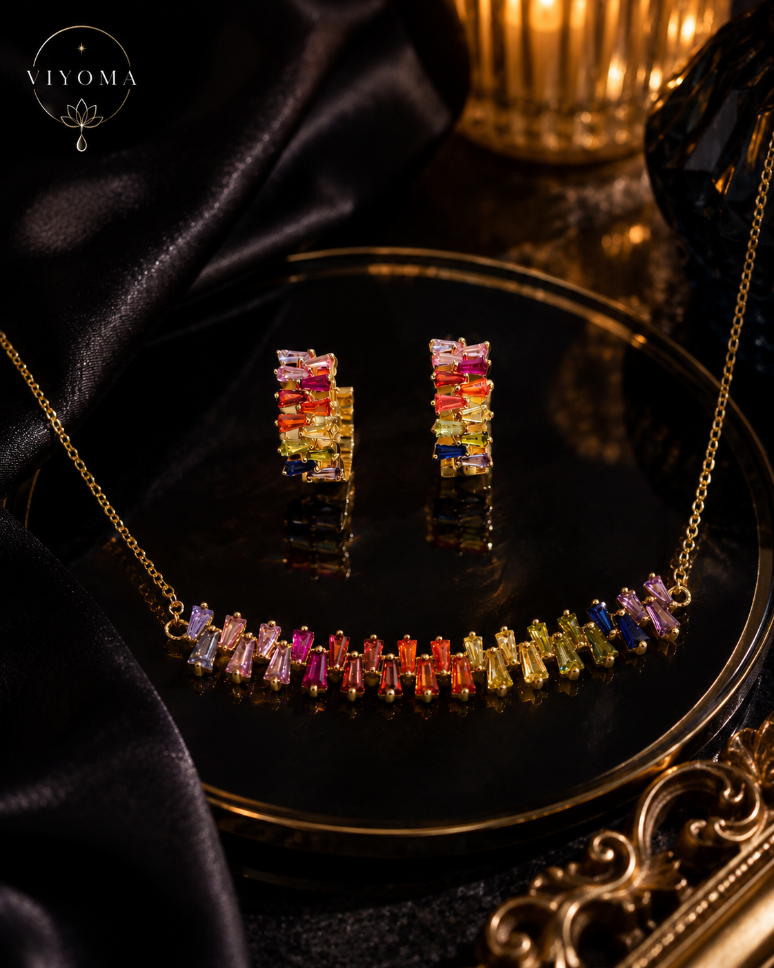 VIYOMA Seraphine Spectrum rainbow crystal necklace and earrings on black velvet background